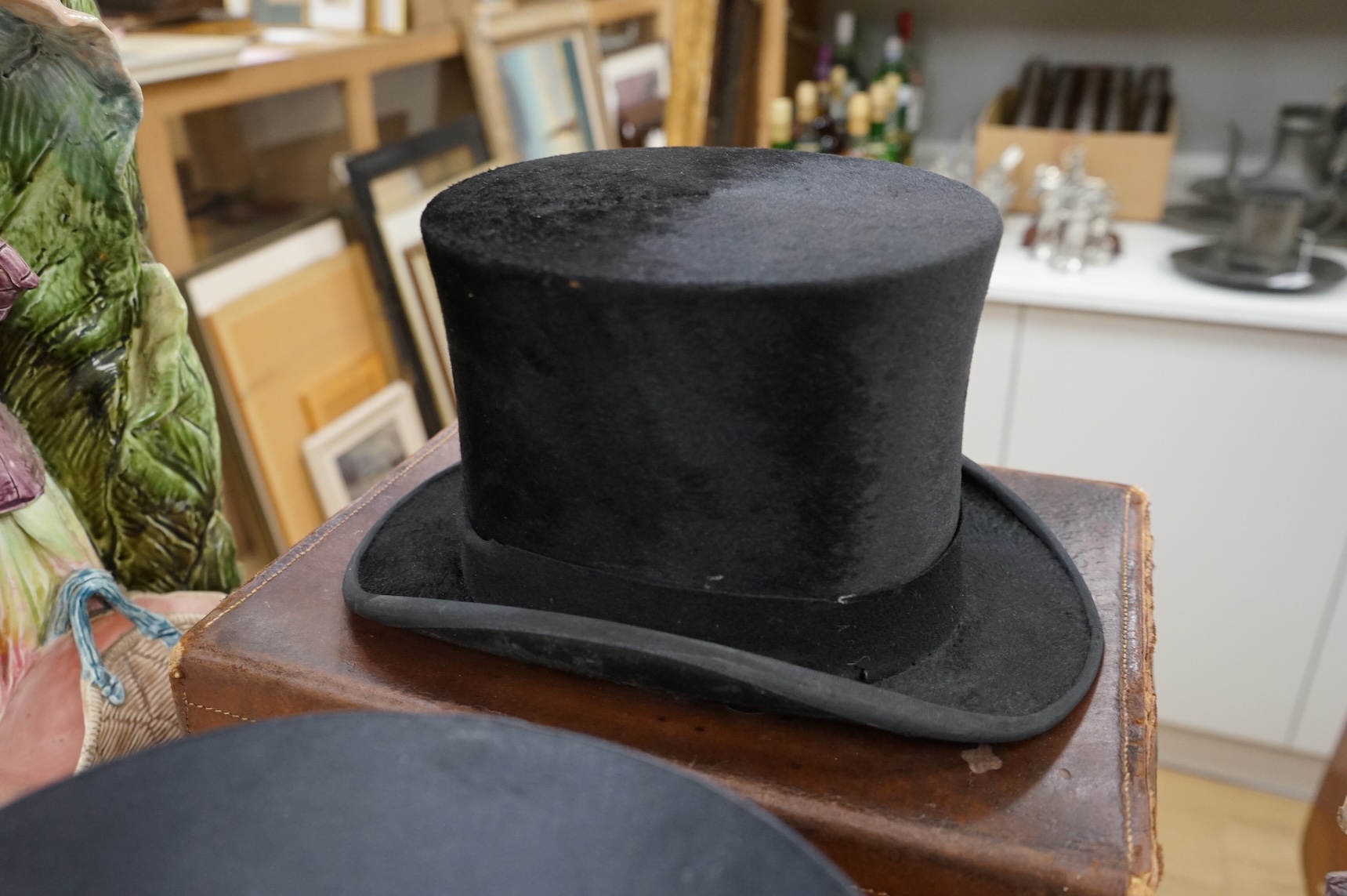 A Scott & Co. top hat with brush in leather case, together with a cased opera hat.